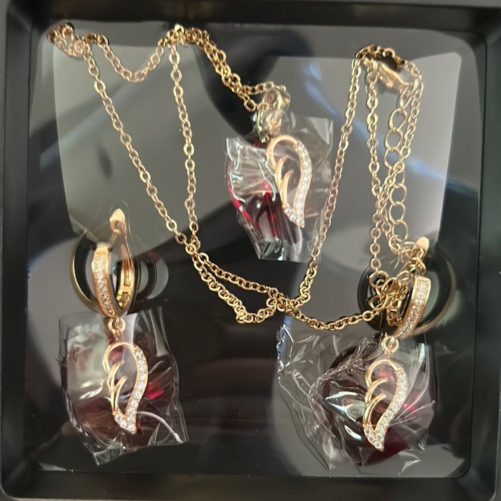 Gold Necklace and Earring Set with Red Hearts and Wing Accents